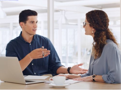 Two people discussing the ease of use of Butterflai's platform